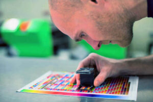 person doing color correction for printed materials